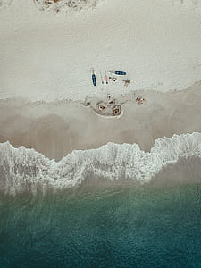 bird's eye view photography of people sea shor thumbnail