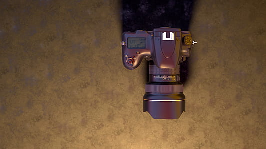 black DSLR camera on black surface thumbnail