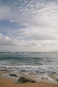 cloudy sky over ocean thumbnail