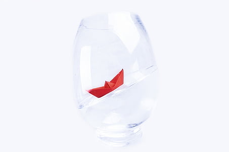 red boat origami in round clear glass cup thumbnail