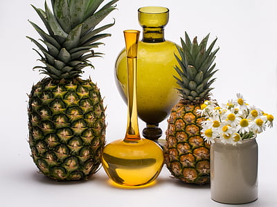 two pineapples and two brown glass vases thumbnail