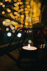 tealight with bokeh lights background thumbnail