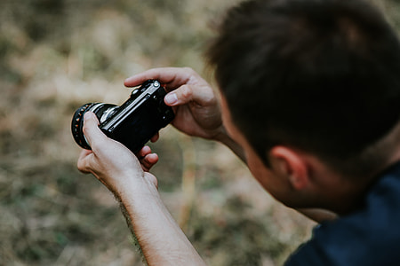 Photographer taking photos of a beautiful, young woman thumbnail