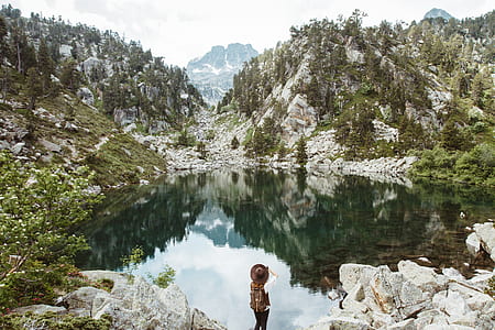 woman standing near the pond thumbnail
