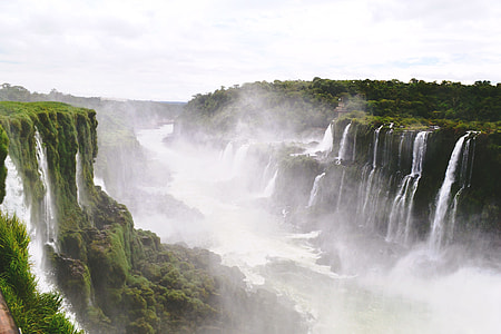 person showing waterfall scenery thumbnail