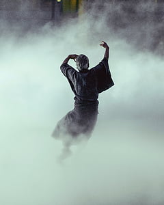 standing man surrounded by fog thumbnail