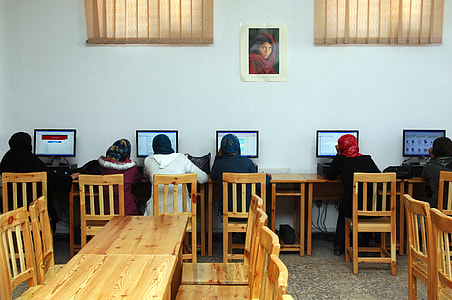 group of five people using computer in library thumbnail