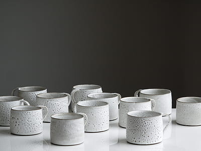 white ceramic mugs on white table thumbnail