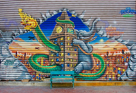 assorted-color mural and bench at daytime thumbnail