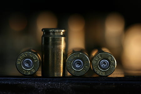 brass-colored bullet between bullets thumbnail