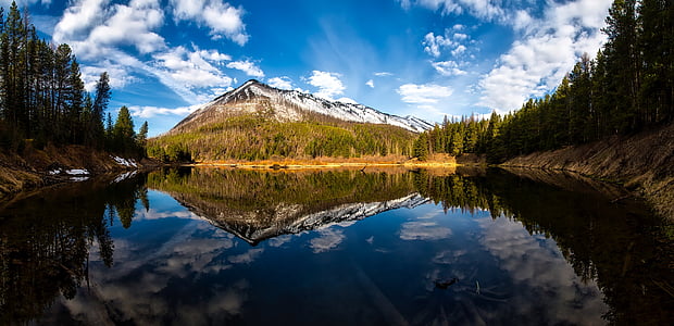body of water background of mountain at daytime thumbnail