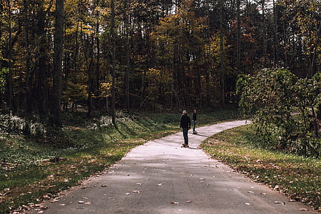 man skateboarding on gray road thumbnail
