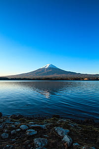 reflection of mountain on water thumbnail