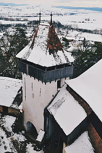 snow covering roof of tower thumbnail