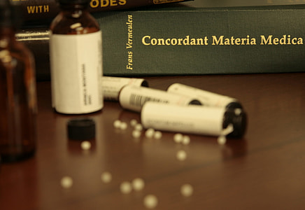 amber glass bottle near book thumbnail