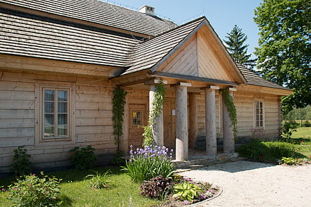 beige wooden cabin in forest thumbnail