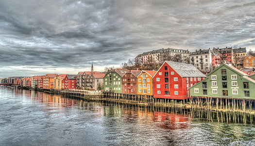assorted-color houses near bodies of water panoramic photography thumbnail