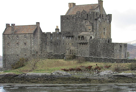 gray concrete castle beside body of water thumbnail