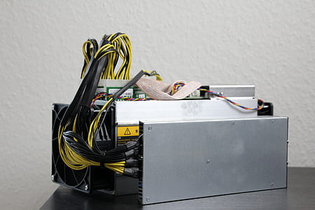 gray Bitcoin antminer on black surface thumbnail
