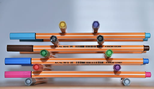 selective close-up photo of assorted-color pile of coloring pens on table thumbnail