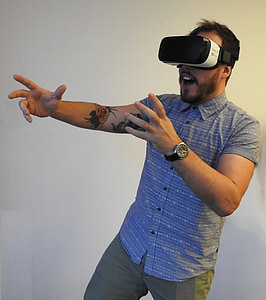 man wearing white and black Gear VR thumbnail
