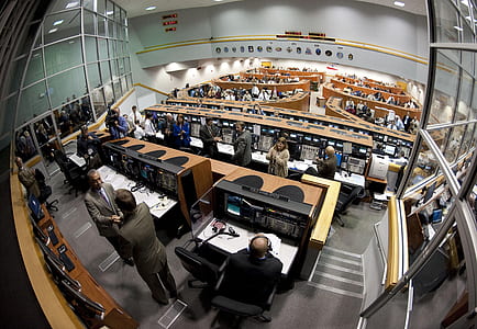 fish-eye photography of a room full of people in front of computers and desks thumbnail