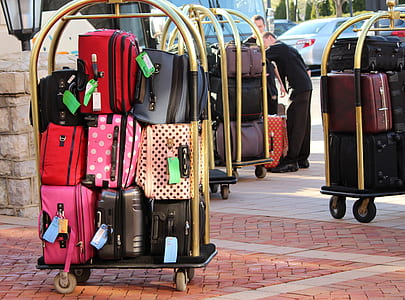 person taking photo of assorted luggage bag lot thumbnail