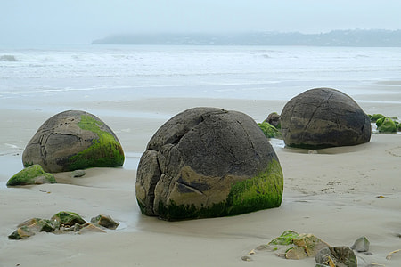 Boulders and rocks on the shore on Koekohe beach, New Zealand thumbnail