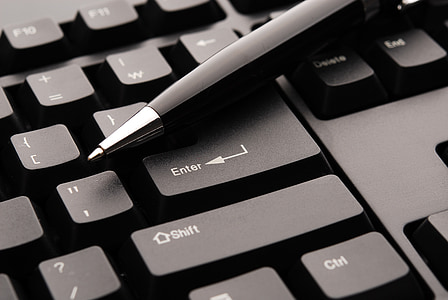 black pen on black computer keyboard thumbnail