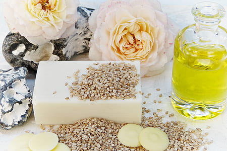 olive oil on jar beside nuts thumbnail