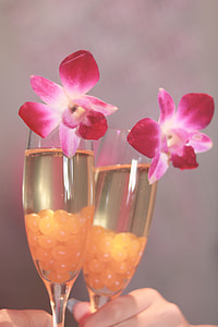 two cocktail glasses with pink flower thumbnail