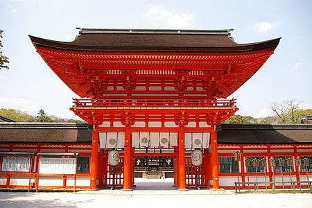photo of red painted building at daytime thumbnail