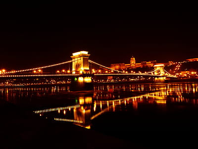 Illuminated Bridge over River at Night thumbnail