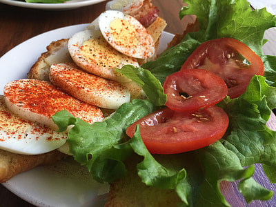 sliced eggs beside tomato and lettuce thumbnail
