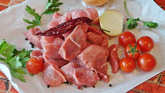 raw meat beside tomatoes and onion thumbnail