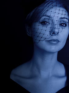 woman wearing net headdress thumbnail