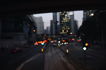 person taking picture of cars running on road thumbnail