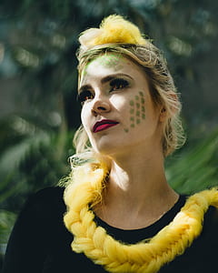 woman wearing black top with yellow hair thumbnail