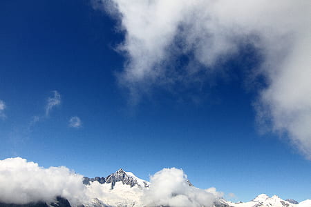 mountain summit under clear blue sky thumbnail