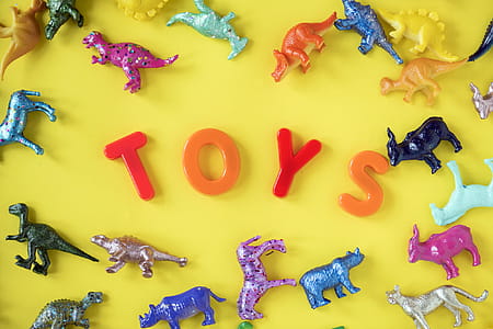 Assorted Plastic Toy on Yellow Surface thumbnail