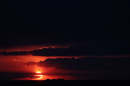 silhouette of clouds at sunset thumbnail