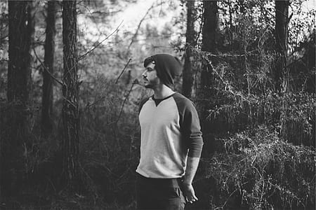 grayscale photography of man on forest thumbnail