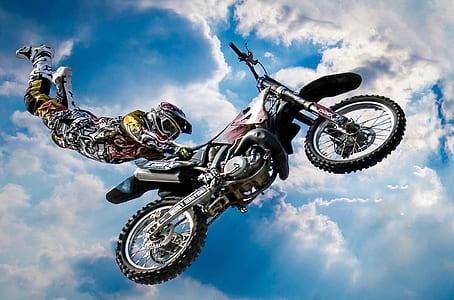 low angle photo of motocross ride doing stunt thumbnail