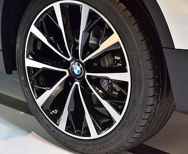 chrome-colored and black BMW multi-spoke vehicle wheel and tire thumbnail