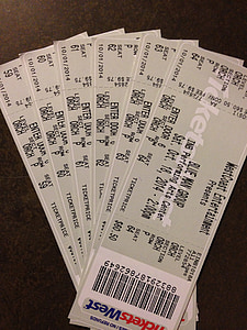 six tickets on brown surface thumbnail