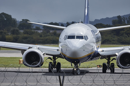 photography of white and blue plane during daytime thumbnail