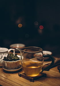clear glass pitcher filled with oil thumbnail