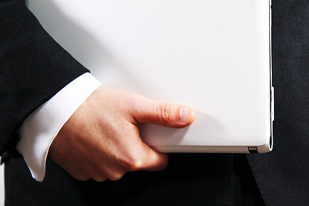person holding white laptop computer thumbnail