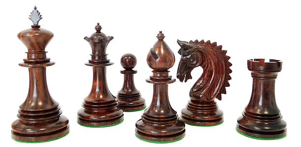 six brown chess pieces on white background thumbnail