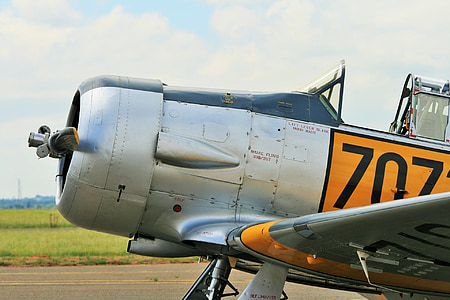 silver, black, and yellow monoplane thumbnail
